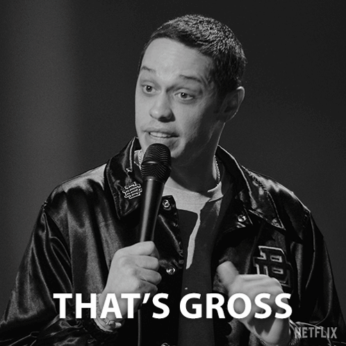 A Black And White Photo Of A Man Holding A Microphone With The Caption That 'S Gross GIF