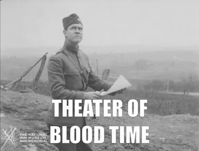 A Black And White Photo Of A Man Holding A Piece Of Paper With The Words Theater Of Blood Time Below Him GIF