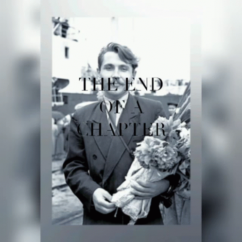 A Black And White Photo Of A Man Holding Flowers With The Words The End Of A Chapter Below Him GIF