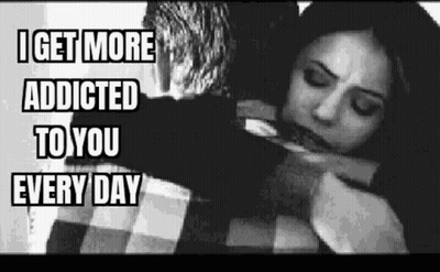 A Black And White Photo Of A Man Hugging A Woman . GIF