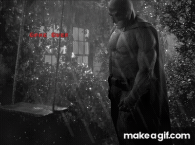 A Black And White Photo Of A Man In A Cape With The Words " Game Over " On The Bottom GIF