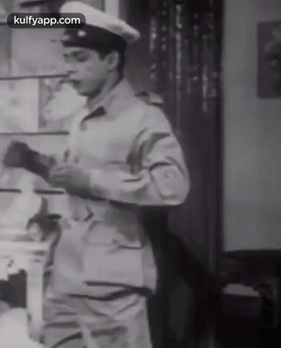 A Black And White Photo Of A Man In A Military Uniform With Kulfyapp.com At The Bottom GIF