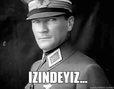 A Black And White Photo Of A Man In A Military Uniform With The Words Izindeyiz Written Below Him GIF