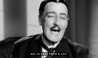 A Black And White Photo Of A Man In A Suit And Tie With His Eyes Closed And The Words Ahi Le Pare Poco A Lei GIF