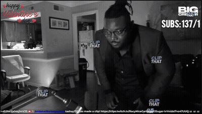 A Black And White Photo Of A Man In A Suit With Clip That Written On The Bottom GIF