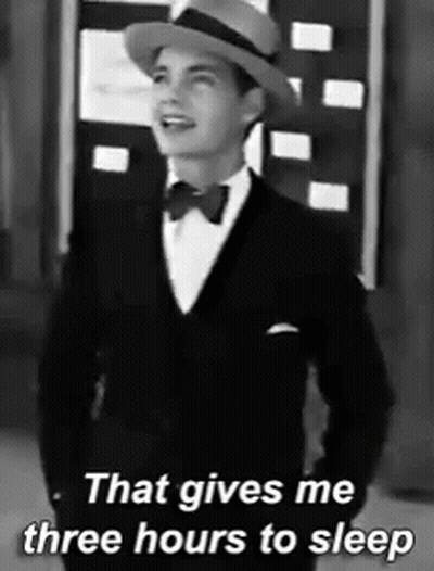 A Black And White Photo Of A Man In A Tuxedo And Hat That Says That Gives Me Three Hours To Sleep GIF