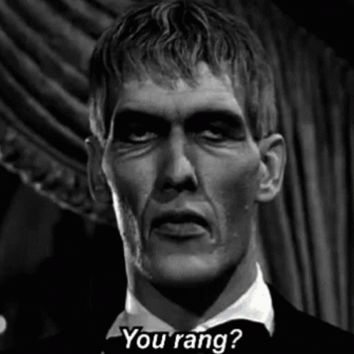 A Black And White Photo Of A Man In A Tuxedo Asking , `` You Rang ? '' GIF