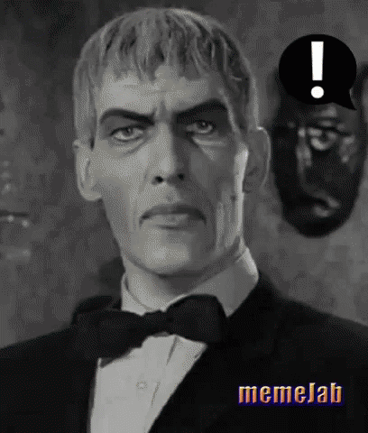 A Black And White Photo Of A Man In A Tuxedo With An Exclamation Point Above Him . GIF
