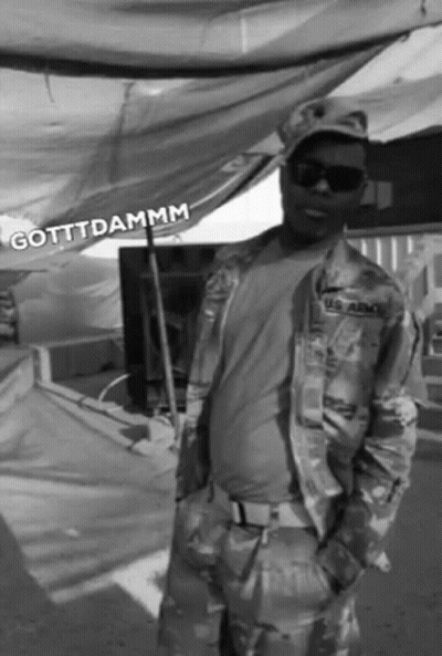 A Black And White Photo Of A Man In A Us Army Uniform GIF