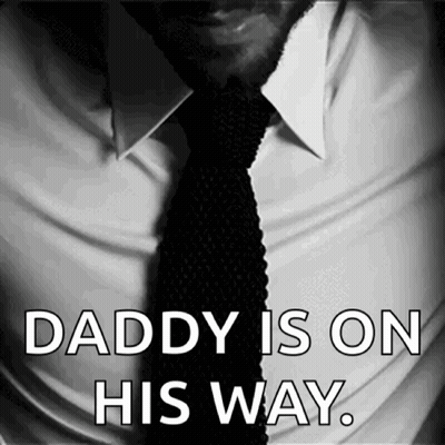 A Black And White Photo Of A Man In A White Shirt And Tie With The Words Daddy Is On His Way GIF
