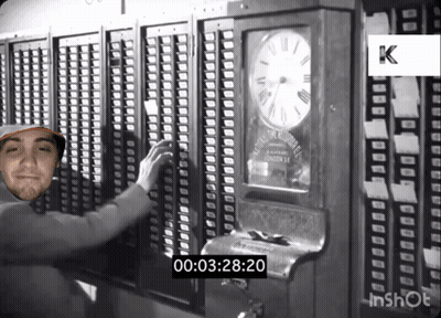 A Black And White Photo Of A Man In Front Of A Clock That Says 00 03 28 20 GIF