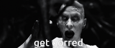 A Black And White Photo Of A Man Laying In The Water With The Words Get Gorred Above Him GIF