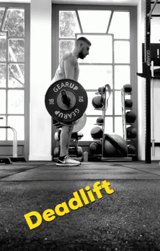 A Black And White Photo Of A Man Lifting A Barbell With The Word Deadlift On The Floor GIF