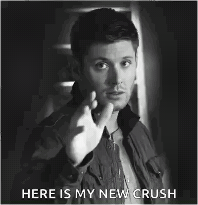 A Black And White Photo Of A Man Making A Funny Face And Saying `` Here Is My New Crush '' . GIF