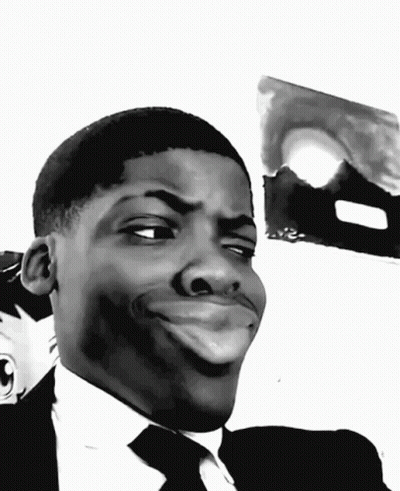 A Black And White Photo Of A Man Making A Funny Face GIF