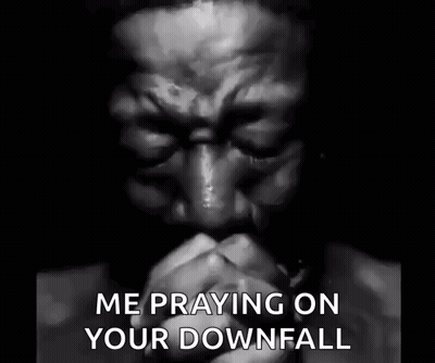 A Black And White Photo Of A Man Praying With His Eyes Closed And The Words `` Me Praying On Your Downfall '' . GIF