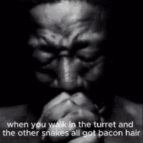A Black And White Photo Of A Man Praying With The Caption " When You Walk In The Turret And The Other Snakes All Got Bac GIF