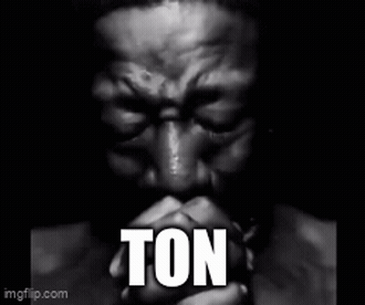 A Black And White Photo Of A Man Praying With The Word Ton Written In White Letters GIF