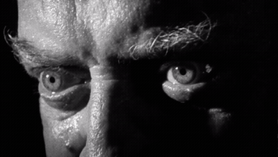 A Black And White Photo Of A Man 'S Eyes With A Hole In Them GIF