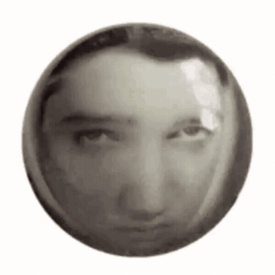 A Black And White Photo Of A Man 'S Face In A Circle . GIF