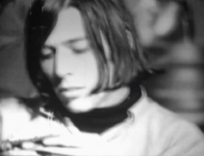 A Black And White Photo Of A Man 'S Face GIF
