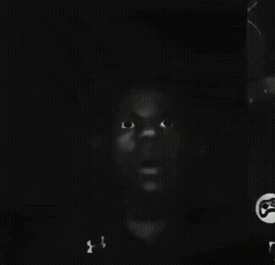 A Black And White Photo Of A Man 'S Face With A Under Armour Shirt On GIF