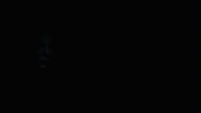 A Black And White Photo Of A Man 'S Face With A White Mask On GIF