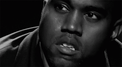 A Black And White Photo Of A Man 'S Face With Tears Coming Down His Face . GIF