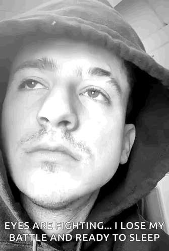 A Black And White Photo Of A Man 'S Face With The Caption Eyes Are Fighting I Lose My Battle And Ready To Sleep GIF