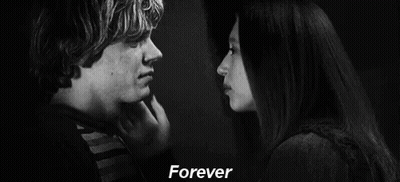 A Black And White Photo Of A Man 'S Face With The Words `` Forever '' Written Above Him . GIF