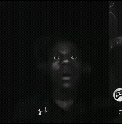 A Black And White Photo Of A Man 'S Face With Under Armour On His Shirt GIF