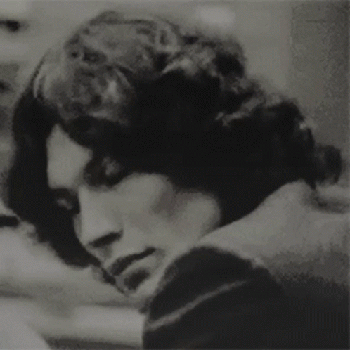 A Black And White Photo Of A Man 'S Face GIF