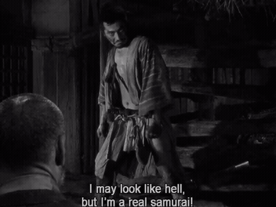 A Black And White Photo Of A Man Saying " I May Look Like Hell " GIF
