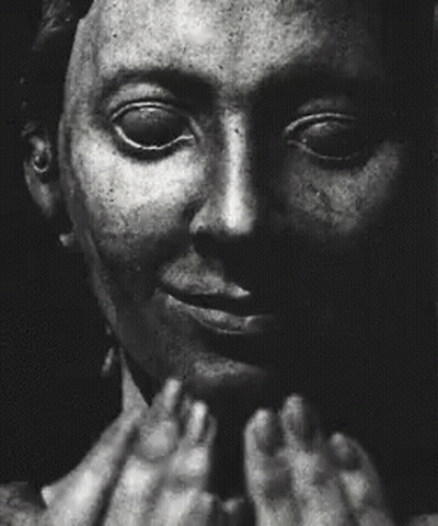 A Black And White Photo Of A Man Screaming With His Mouth Wide Open GIF