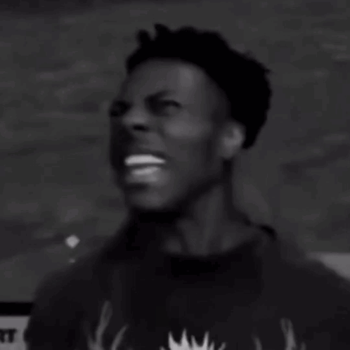 A Black And White Photo Of A Man Screaming With His Mouth Wide Open . GIF