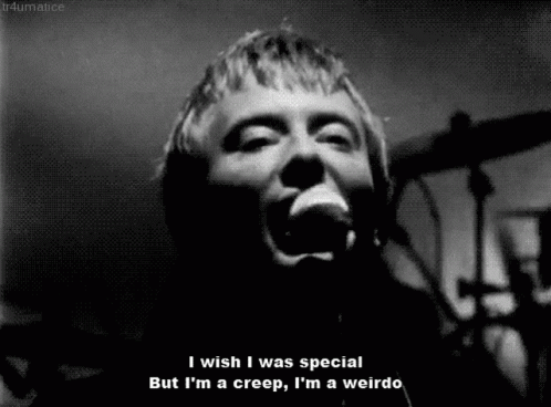 A Black And White Photo Of A Man Singing Into A Microphone With The Caption I Wish I Was Special GIF