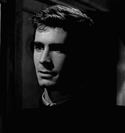 A Black And White Photo Of A Man Smiling GIF