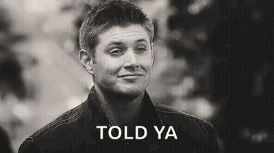 A Black And White Photo Of A Man Smiling With The Words `` Told Ya '' Written On The Bottom . GIF