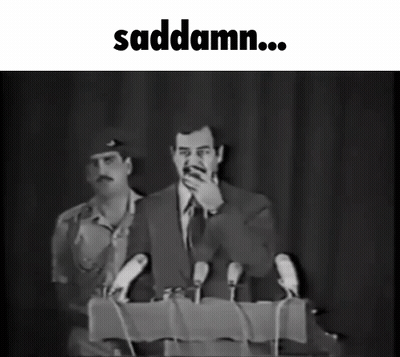 A Black And White Photo Of A Man Speaking Into Microphones With The Words Saddamn Below Him GIF