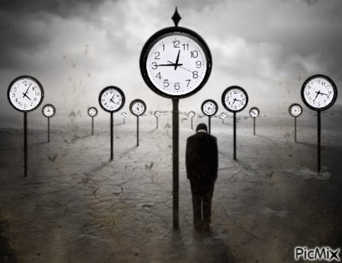 A Black And White Photo Of A Man Standing In Front Of A Row Of Clocks That Says Picmix At The Bottom GIF
