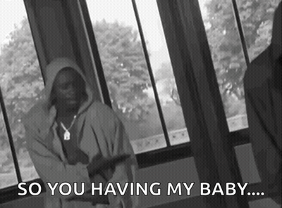 A Black And White Photo Of A Man Standing In Front Of A Window With The Words `` So You Having My Baby ... '' GIF