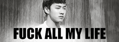 A Black And White Photo Of A Man Standing In The Rain With The Words `` Fuck All My Life '' Written Above Him . GIF