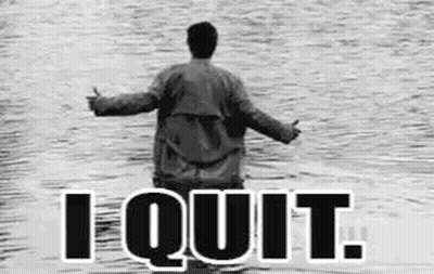 A Black And White Photo Of A Man Standing In The Water With The Words `` I Quit '' Written On The Bottom . GIF