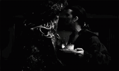 A Black And White Photo Of A Man Standing Next To A Monster In A Pirate Costume . GIF