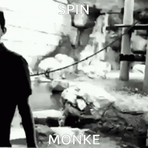 A Black And White Photo Of A Man Standing Next To A River With A Caption That Says `` Spin Monke '' . GIF