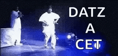 A Black And White Photo Of A Man Standing On A Stage With The Words Datz A Cet Written Above Him . GIF
