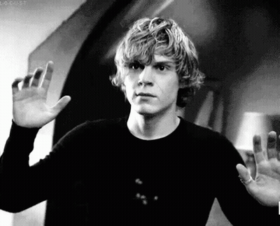A Black And White Photo Of A Man Waving His Hand GIF