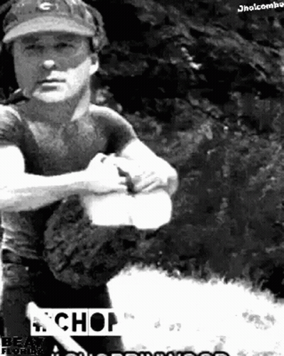 A Black And White Photo Of A Man Wearing A Baseball Cap And Holding A Bat With The Word Chop On The Bottom GIF