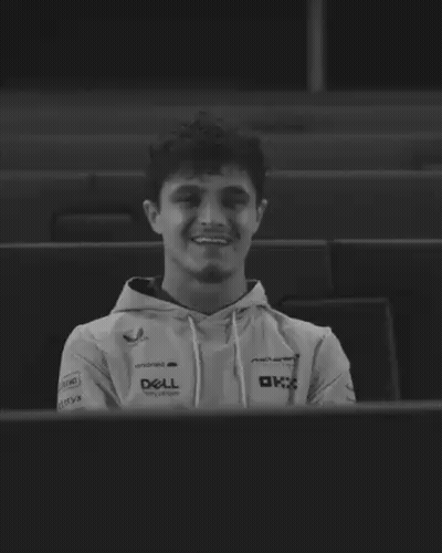 A Black And White Photo Of A Man Wearing A Dell Sweatshirt GIF