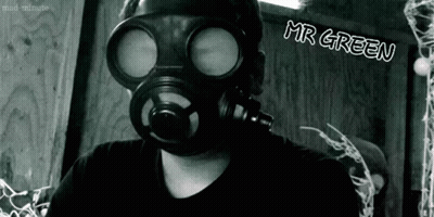 A Black And White Photo Of A Man Wearing A Gas Mask With Mr Green Written On The Bottom GIF